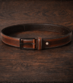 Genuine Moroccan leather belts in multiple colors laid flat, handcrafted in Fès Morocco