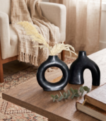 Double black ceramic vase set with matte finish displayed on white marble surface