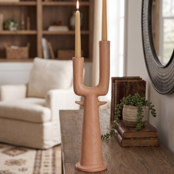 Dual branch ceramic vase with two curved necks on a white marble surface
