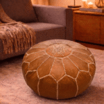 Handmade Moroccan leather pouf with intricate white starburst embroidery