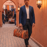 Woman carrying authentic Moroccan handcrafted brown leather shoulder bag in medina street, genuine leather artisan bag from Marrakech Morocco
