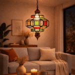 Moroccan filigree glass hanging lamp with intricate hand-cut metal latticework and colored glass inserts