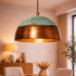 Oxidized metal table lamp with antique bronze finish on a wooden side table