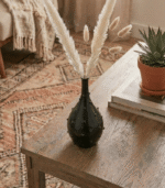 Handmade black ceramic bottle-shaped vase with modern minimalist design for home decor