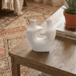 White sculptural ceramic vase with dual spouts and hollow center modern home decor