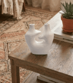 White sculptural ceramic vase with dual spouts and hollow center modern home decor