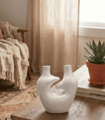 Handcrafted White Sculptural Ceramic Vase with Dual Spouts and Hollow Center - Image 4