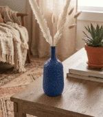 Handcrafted blue ceramic bottle-shaped vase with elegant finish for modern home decor