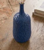 Handcrafted blue ceramic bottle-shaped vase with elegant finish for modern home decor