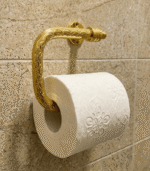 Hand-engraved unlacquered brass toilet paper holder with artisan detailing