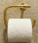 Hand-engraved unlacquered brass toilet paper holder with artisan detailing