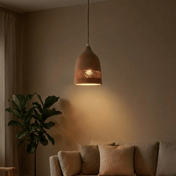 Handmade perforated terracotta hanging lamp crafted from fired clay with decorative cutout holes