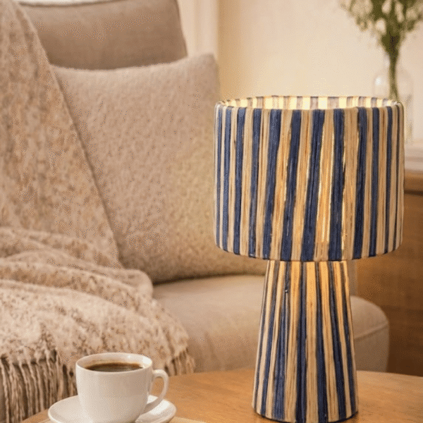 Handmade Moroccan raffia table lamp with blue and natural beige woven stripes